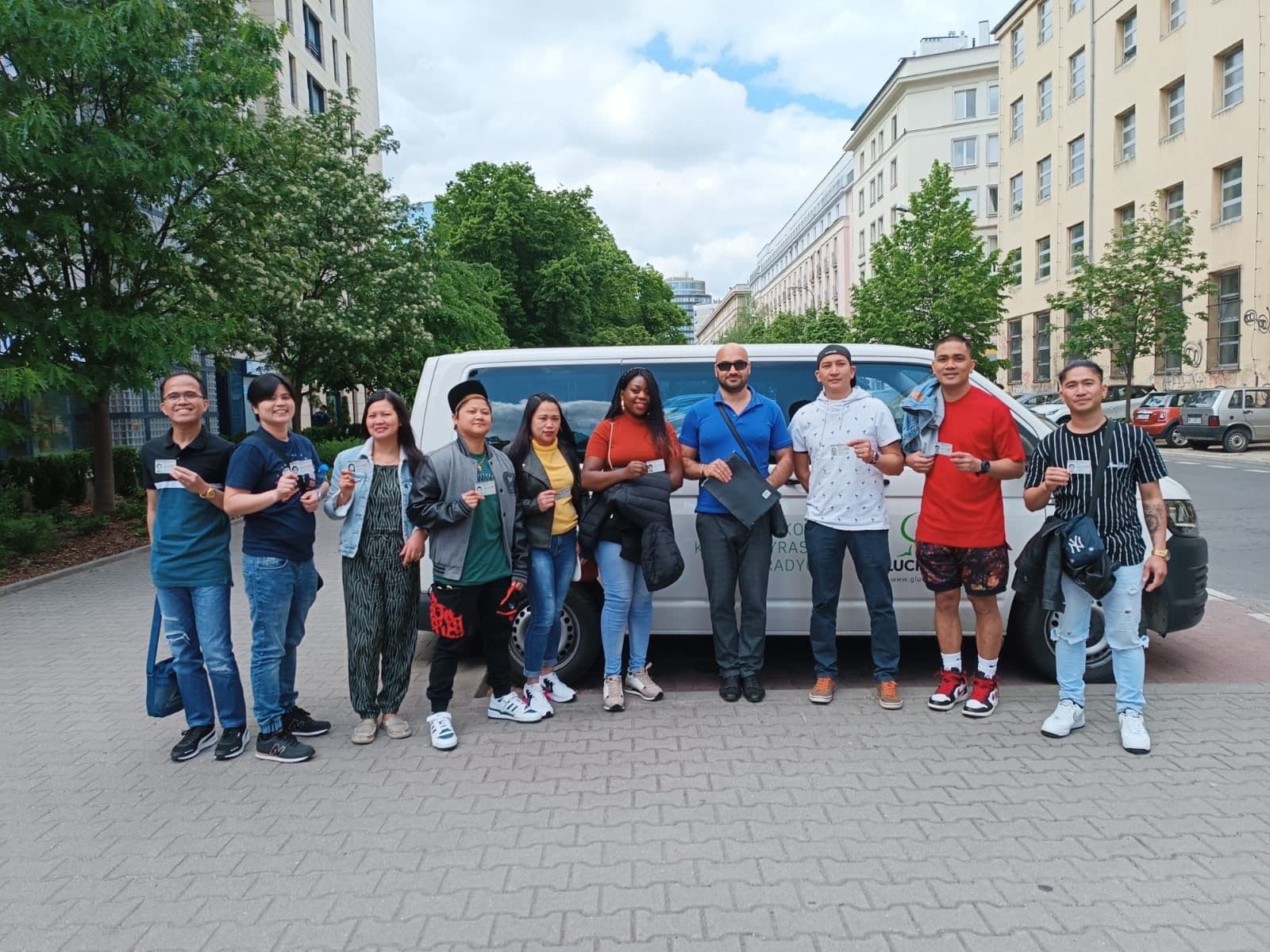 Workers with their residence cards, after arriving in Europe