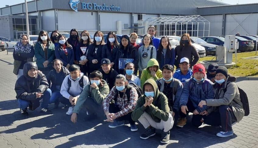 A group of workers outside the BG Production plant